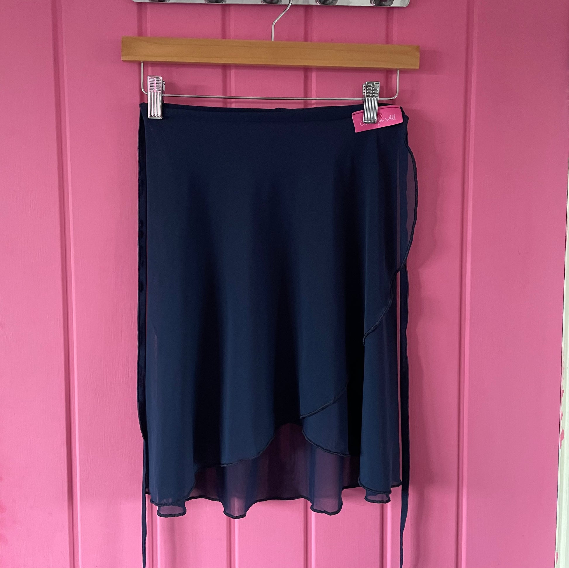 Navy colour skirts with a sheer overlay on a pink background