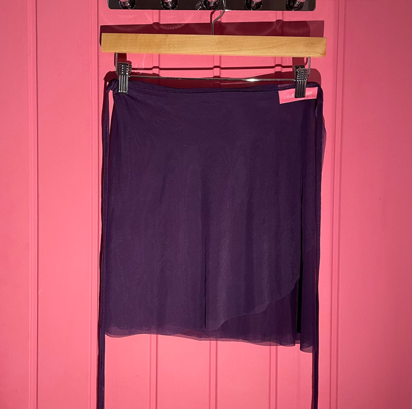 Purple colour skirts with a sheer overlay on a Pink background