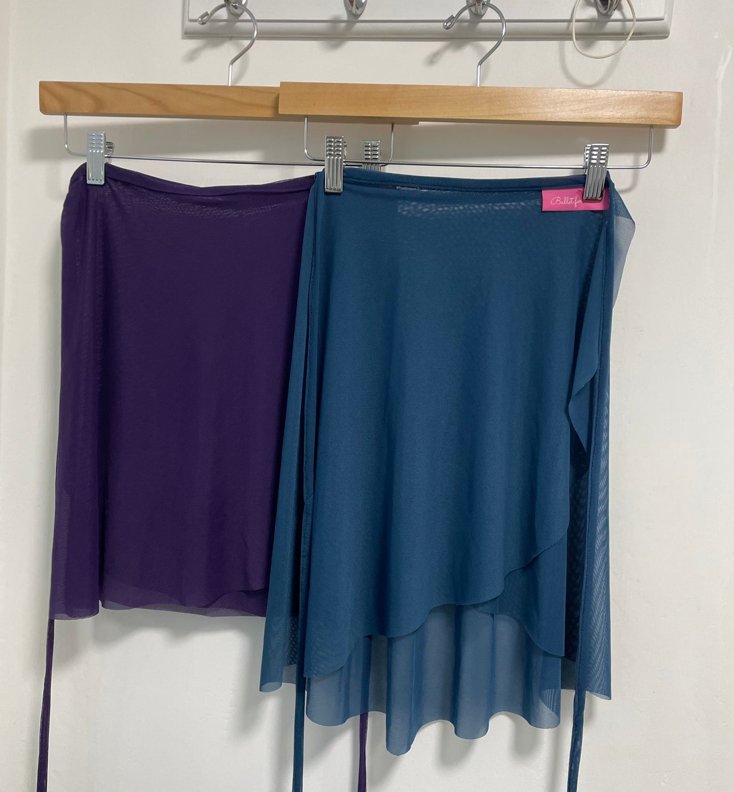 Purple & Blue colour skirts with a sheer overlay on a white background