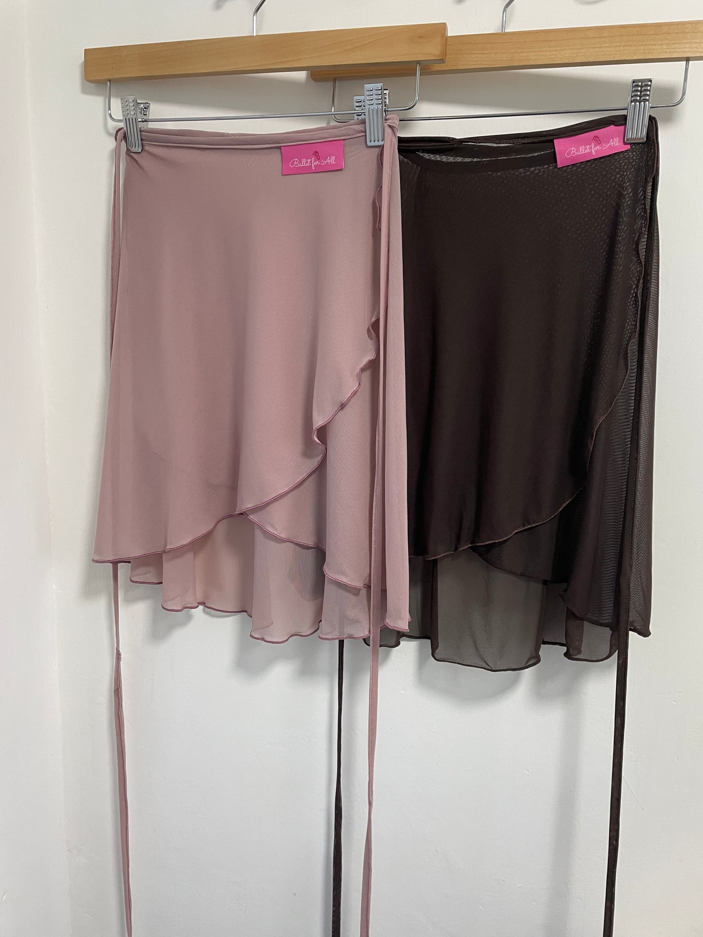 Heather & Chocolate colour skirts with a sheer overlay on a white background